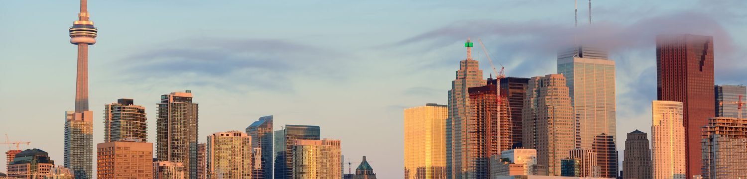 Toronto sunrise with sunlight reflection over lake in the morning